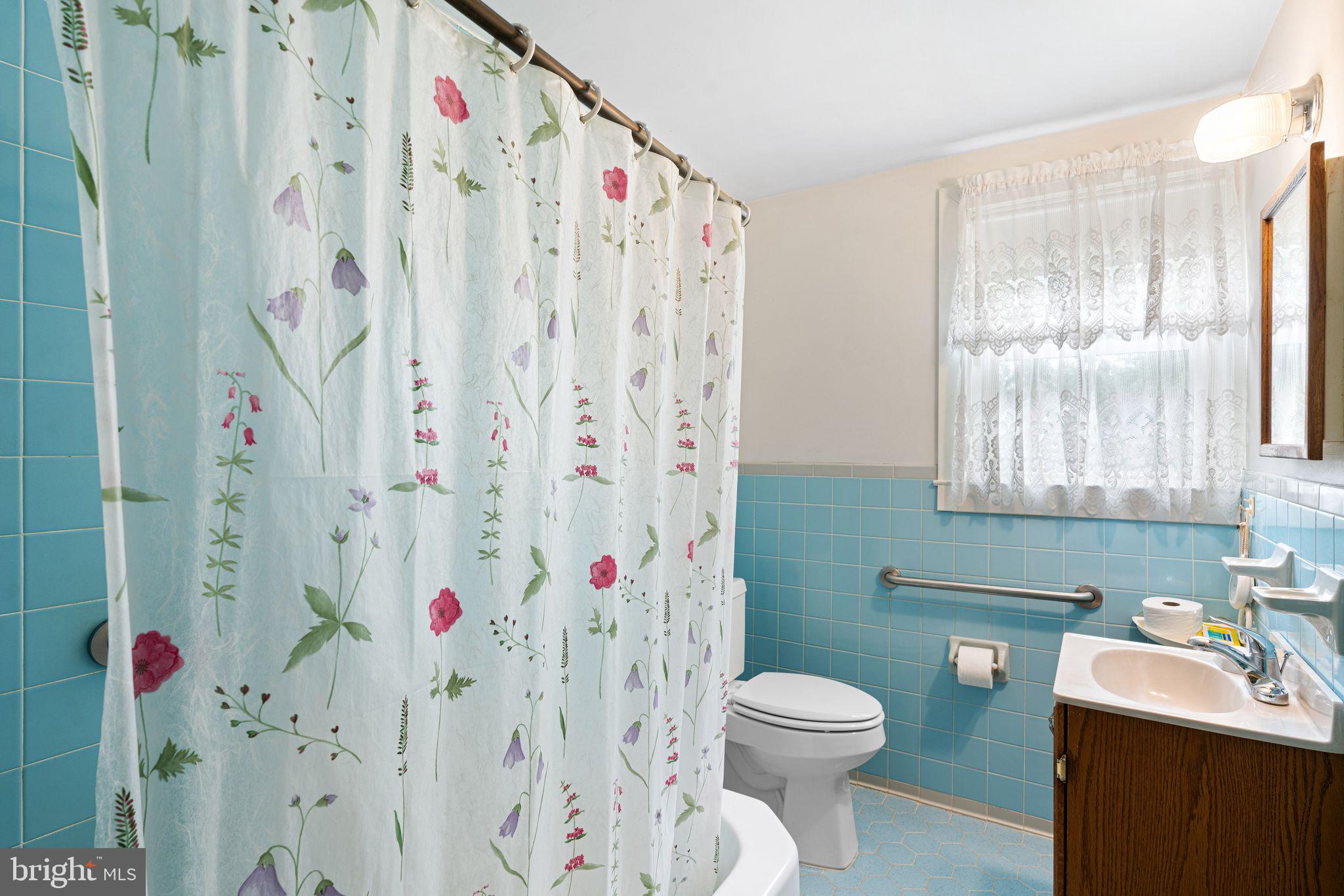 122 West Cottage Avenue Haddonfield, NJ 08033 - Photo 19 of 23 a bathroom with a toilet sink and shower curtain