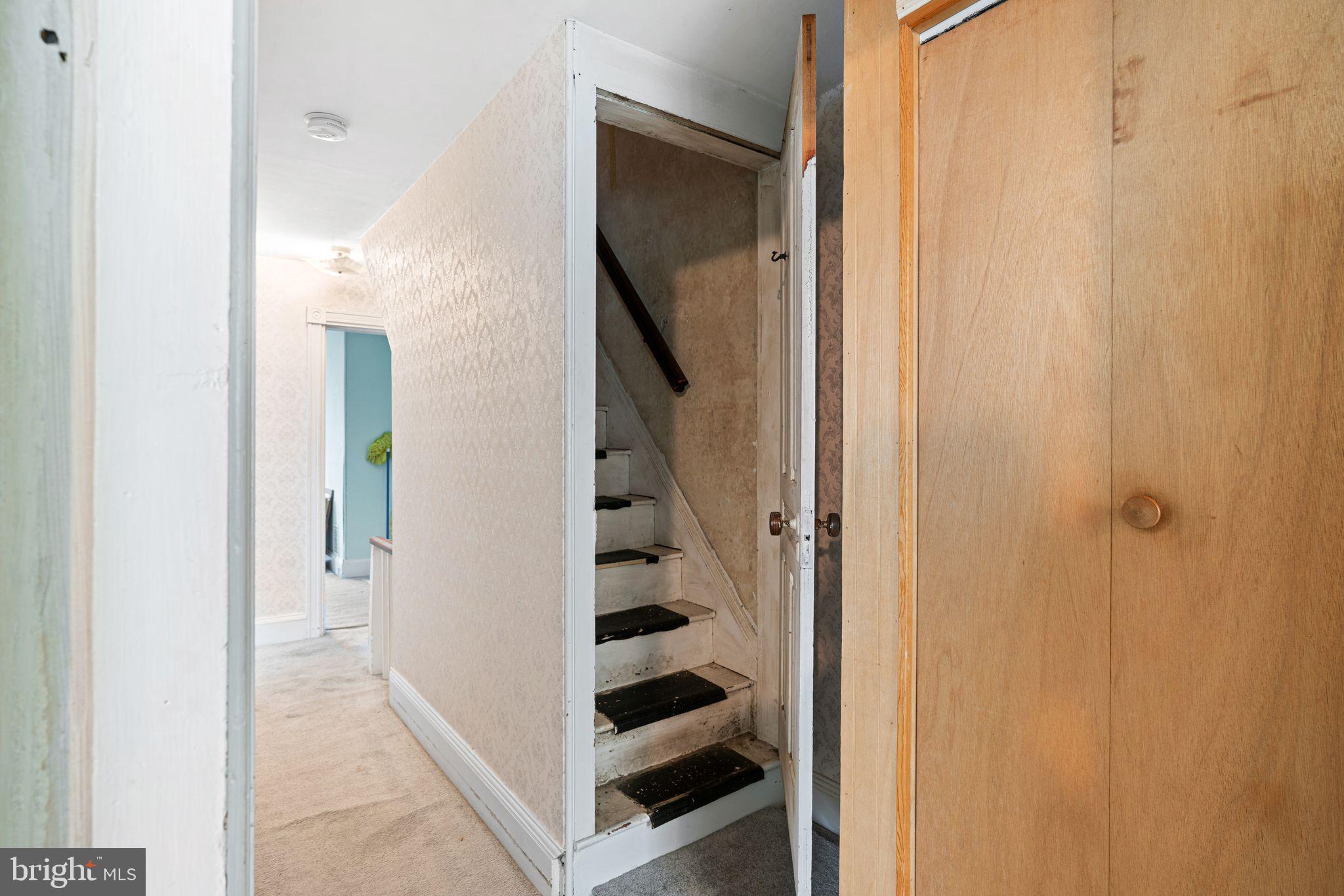 122 West Cottage Avenue Haddonfield, NJ 08033 - Photo 20 of 23 a view of a hallway with white walls and stairs