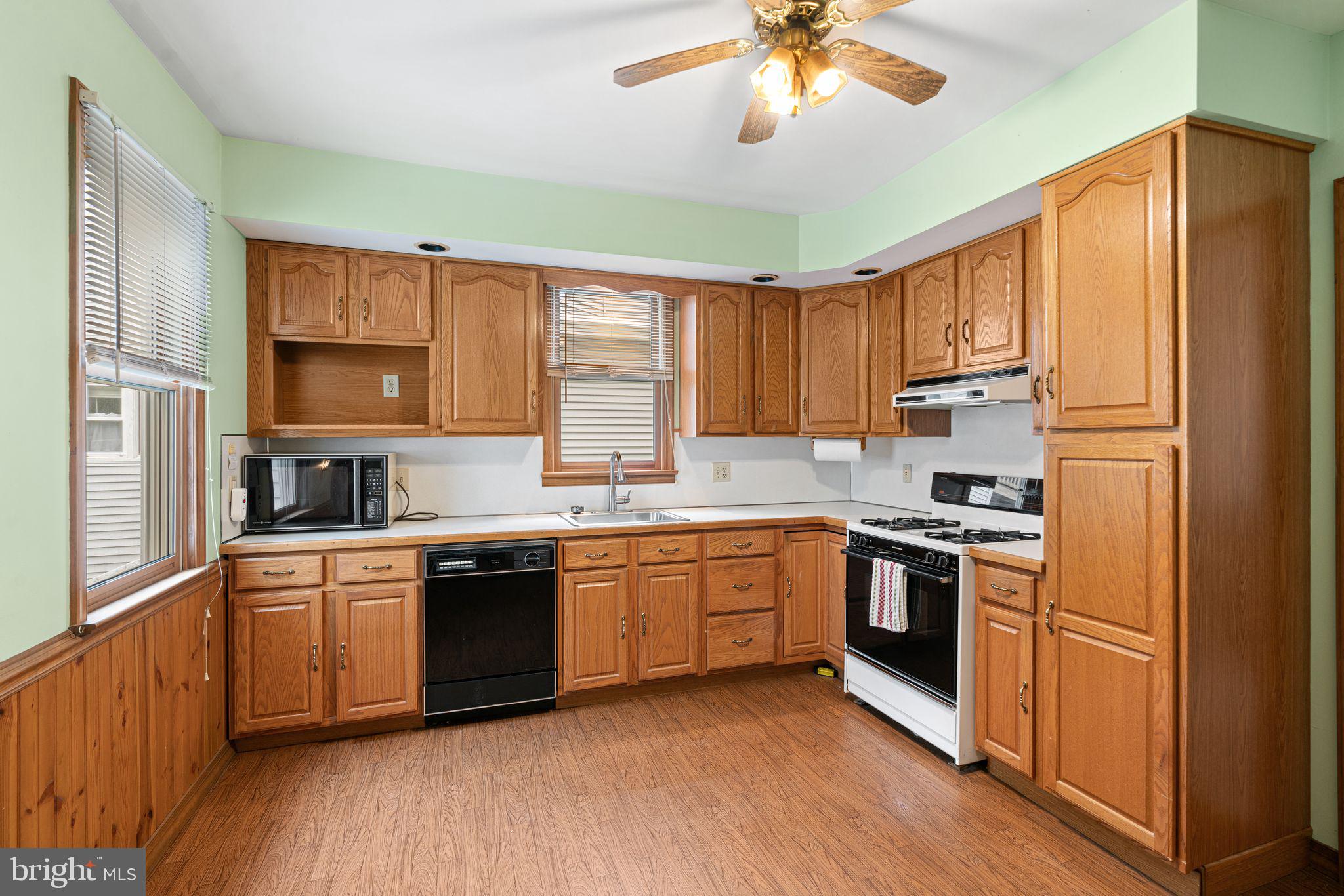 122 West Cottage Avenue Haddonfield, NJ 08033 - Photo 3 of 23 a kitchen with stainless steel appliances granite countertop a stove top oven a sink dishwasher and a refrigerator
