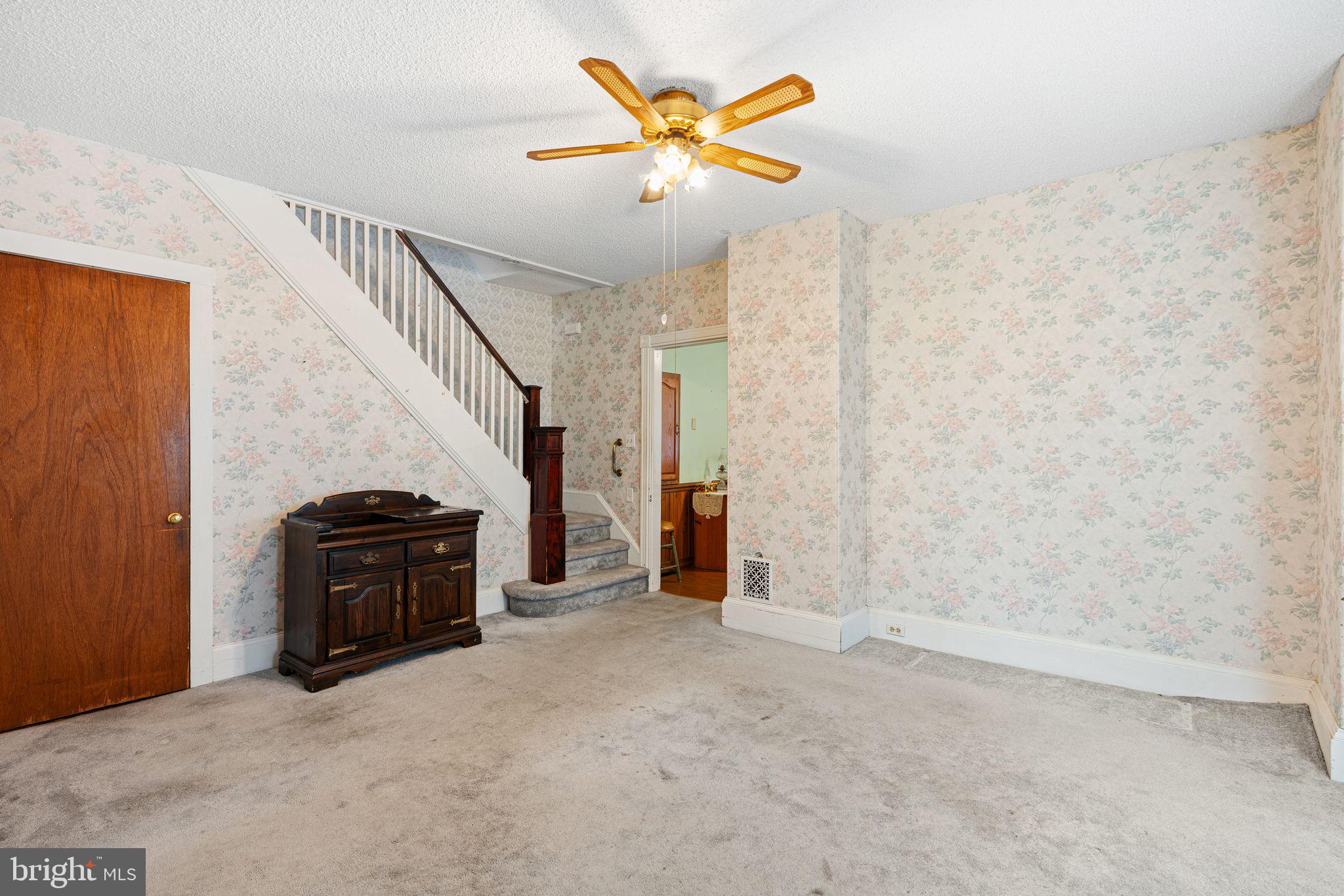 122 West Cottage Avenue Haddonfield, NJ 08033 - Photo 10 of 23 a view of a livingroom with a ceiling fan and wooden floor