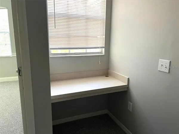 an empty room with closet area