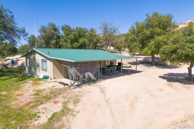 a kitchen with white cabinets and appliances