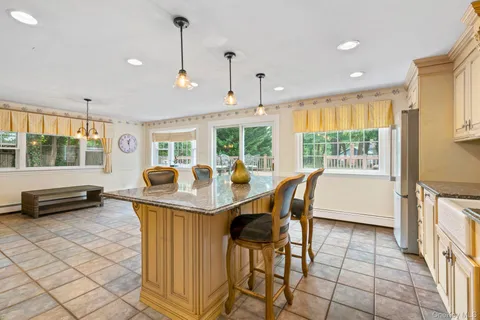 a view of a dining room with furniture window and outside view