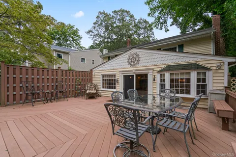 a view of house with patio and outdoor seating