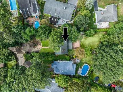 an aerial view of a house with a garden