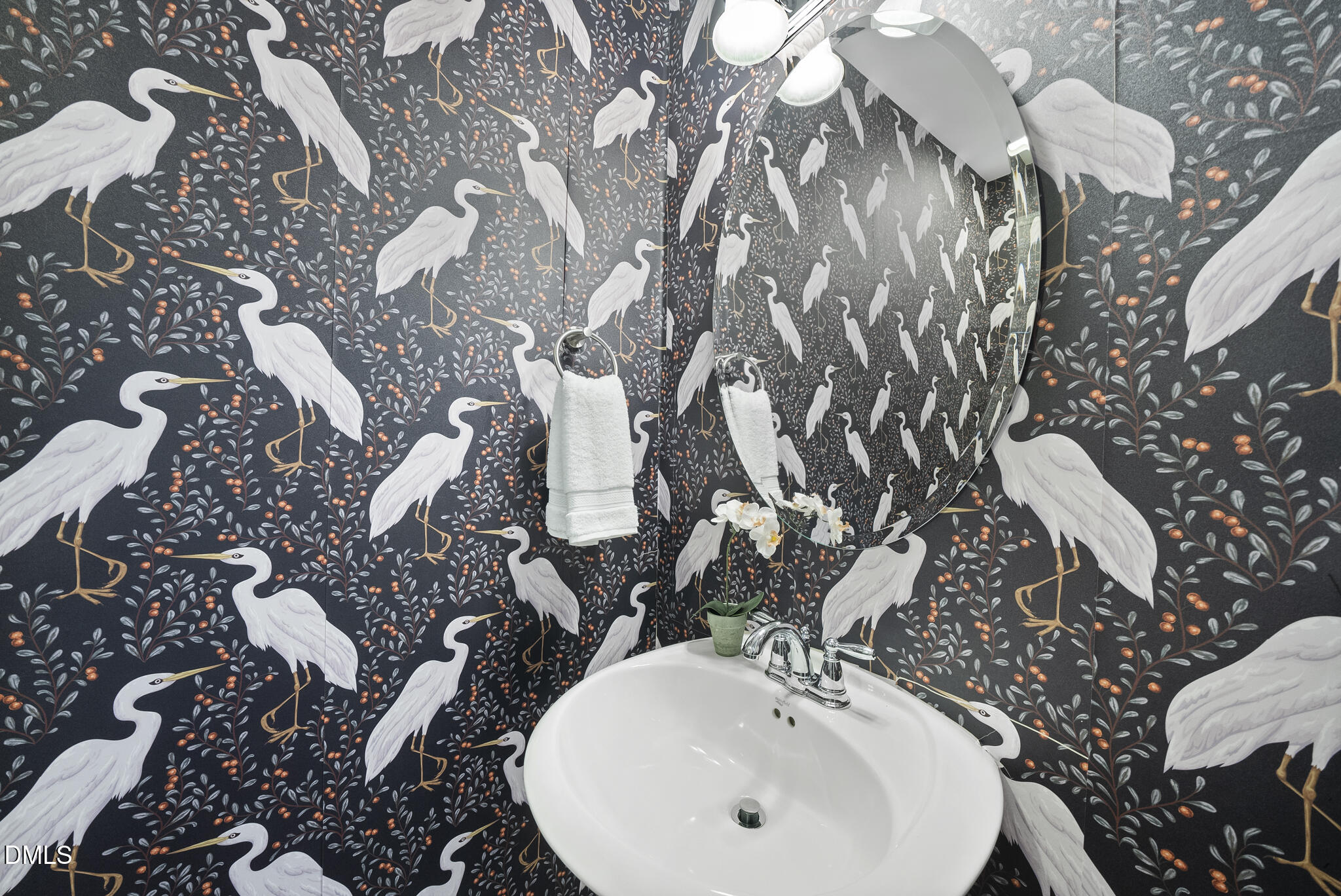 765 Fallon Grove Way Raleigh, NC 27608 - Photo 20 of 43 a bathroom with a sink and mirror