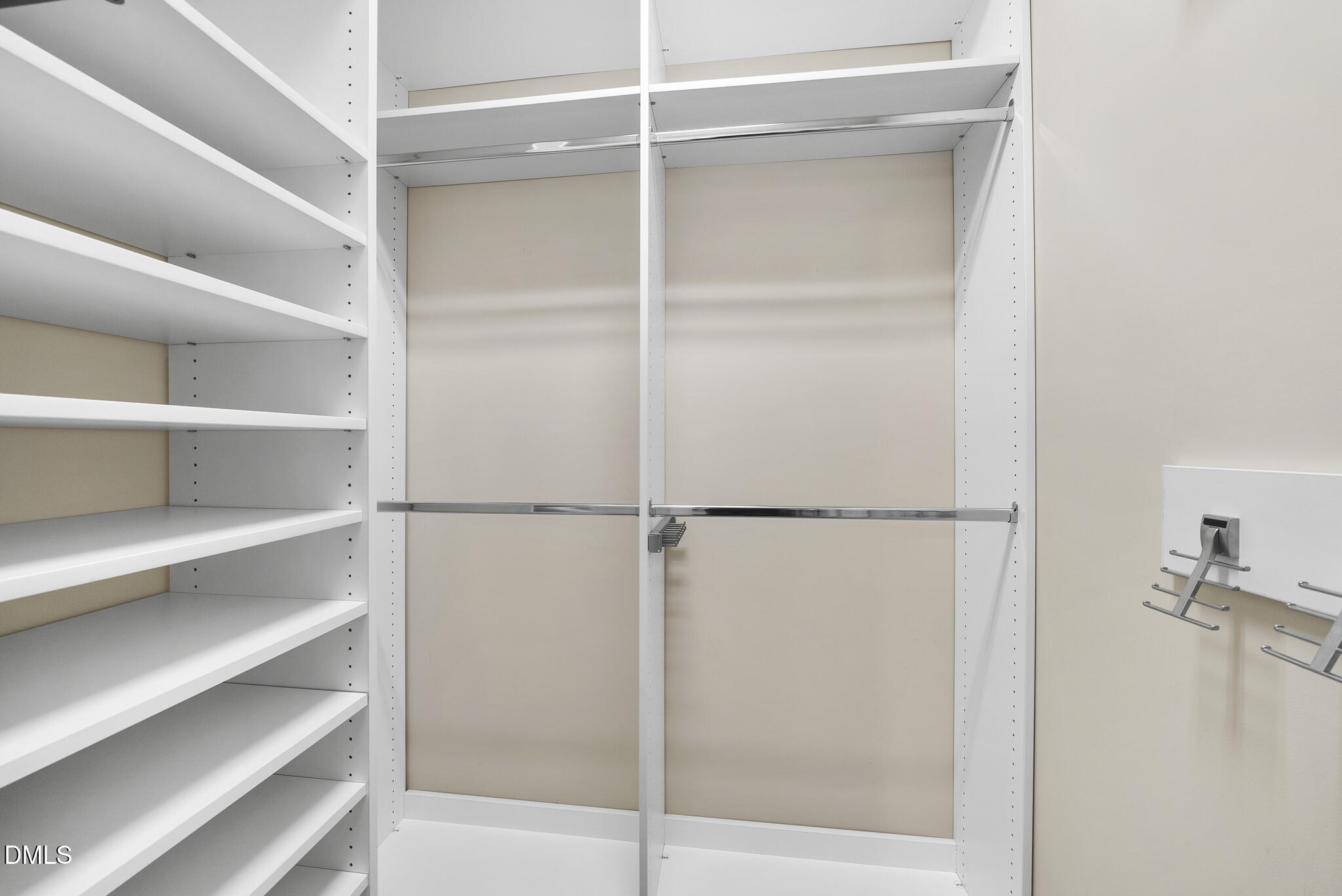 765 Fallon Grove Way Raleigh, NC 27608 - Photo 26 of 43 a view of walk in closet with empty racks