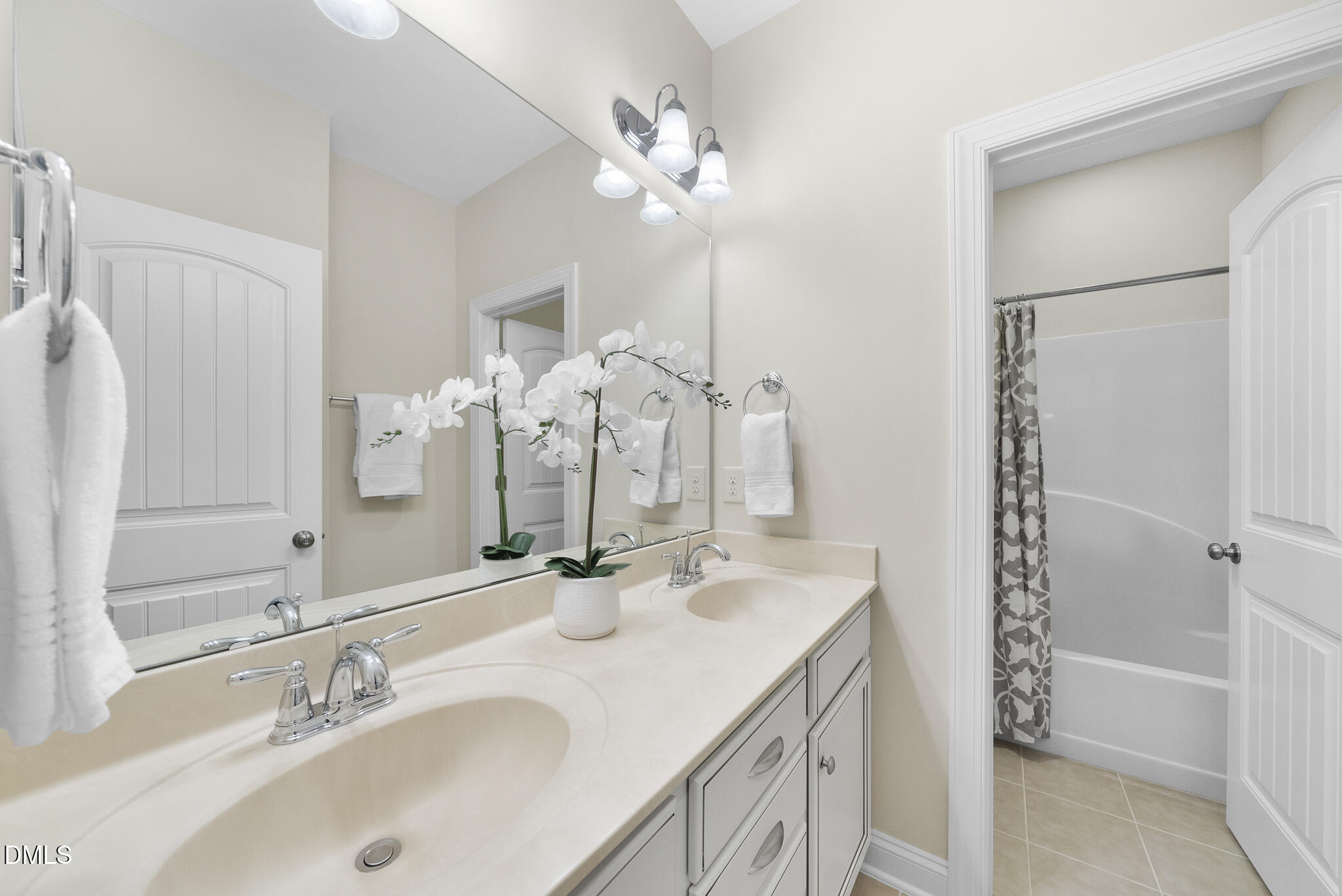 765 Fallon Grove Way Raleigh, NC 27608 - Photo 30 of 43 a bathroom with a granite countertop sink a large mirror and shower