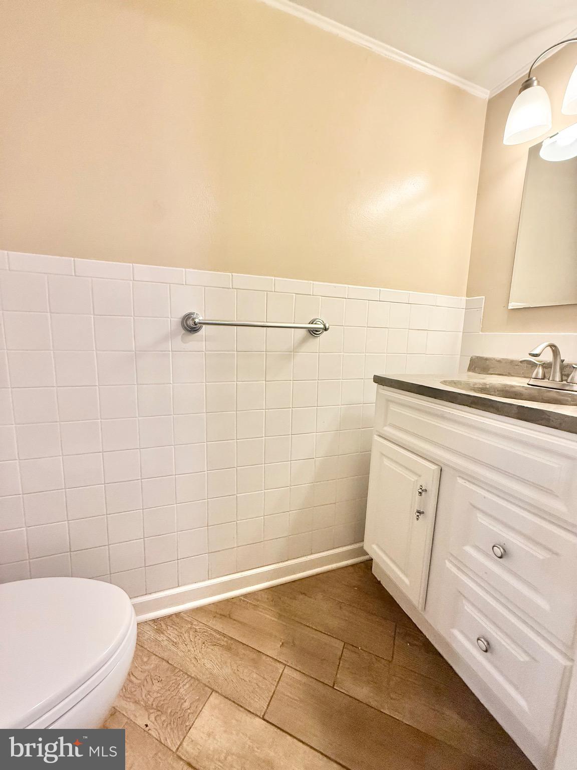 5439 Richenbacher Avenue Alexandria, VA 22304 - Photo 16 of 23 a bathroom with a sink a toilet and shower