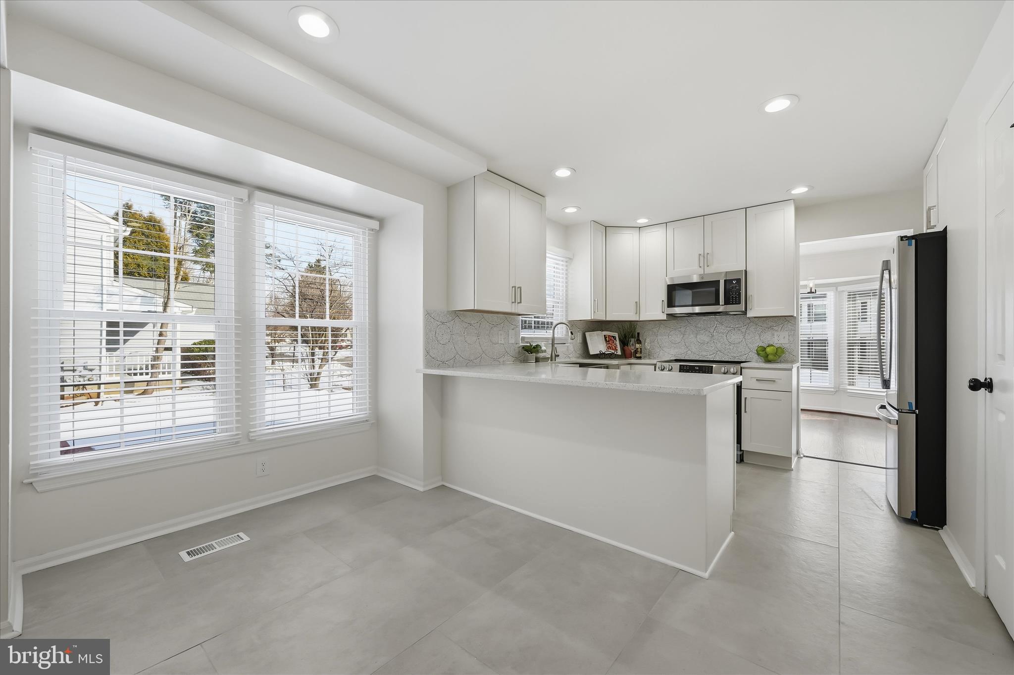 9500 Windbeat Way Columbia, MD 21046 - Photo 19 of 64 Eat-in kitchen with space for table and barstools