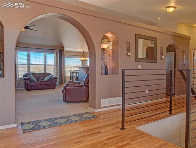 11601 Rio Secco Road Peyton, CO 80831 - Photo 4 of 36 Wonderful Architectural Arches Greet you when you enter