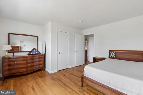 a bed room with a bed and a dresser