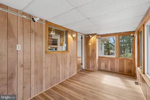 a view of a room with wooden floor and walls