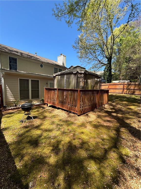 4949 Penscot Way Stone Mountain, GA 30088 - Photo 40 of 40 a view of a house with wooden fence
