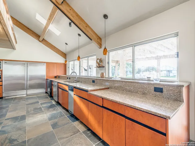 a view of bedroom with furniture and large window