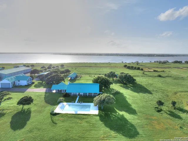 a kitchen with stainless steel appliances granite countertop a sink and stove