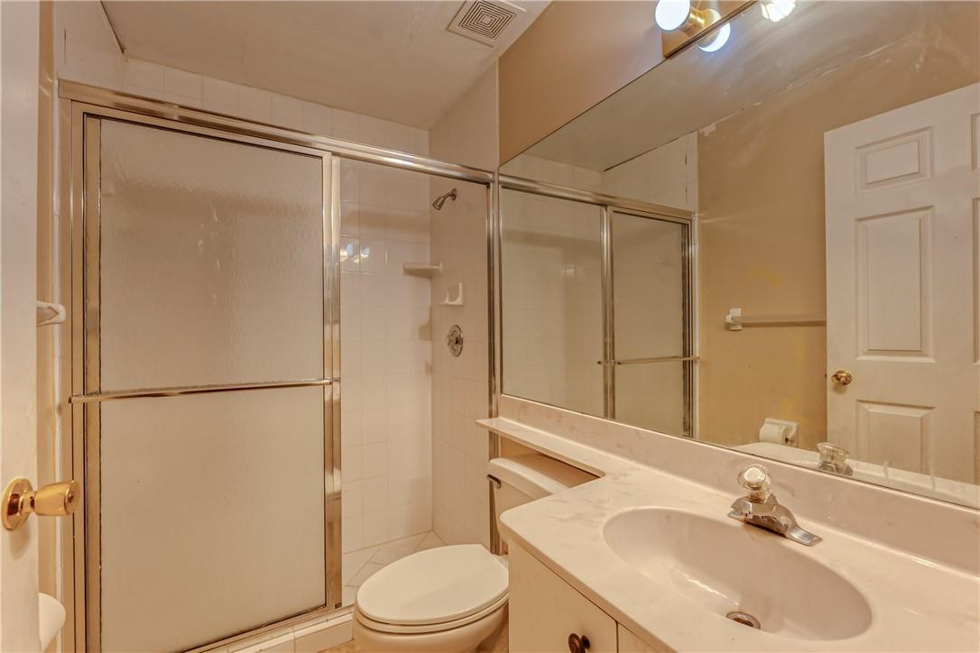 22372 Collington Drive Boca Raton, FL 33428 - Photo 17 of 22 a bathroom with a sink toilet and shower