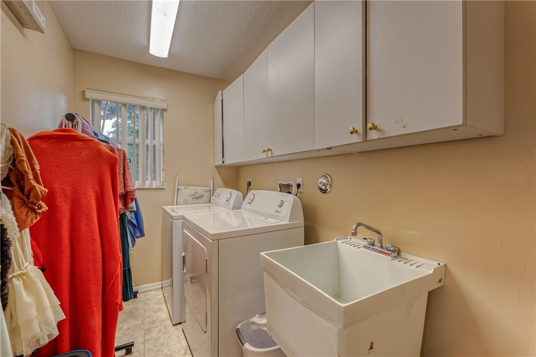 22372 Collington Drive Boca Raton, FL 33428 - Photo 18 of 22 a utility room with dryer and washer