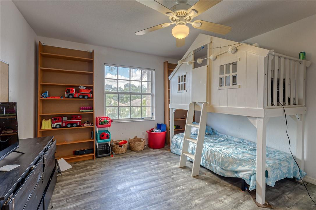 22372 Collington Drive Boca Raton, FL 33428 - Photo 20 of 22 a bedroom with furniture and a window