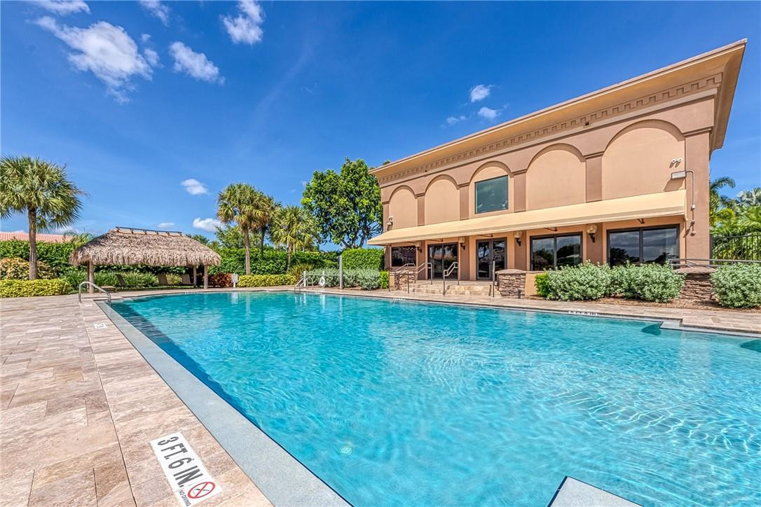 22372 Collington Drive Boca Raton, FL 33428 - Photo 3 of 22 a front view of a house with a yard