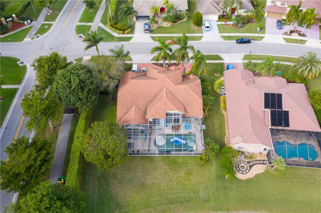 22372 Collington Drive Boca Raton, FL 33428 - Photo 4 of 22 an aerial view of a house with pool yard and outdoor seating