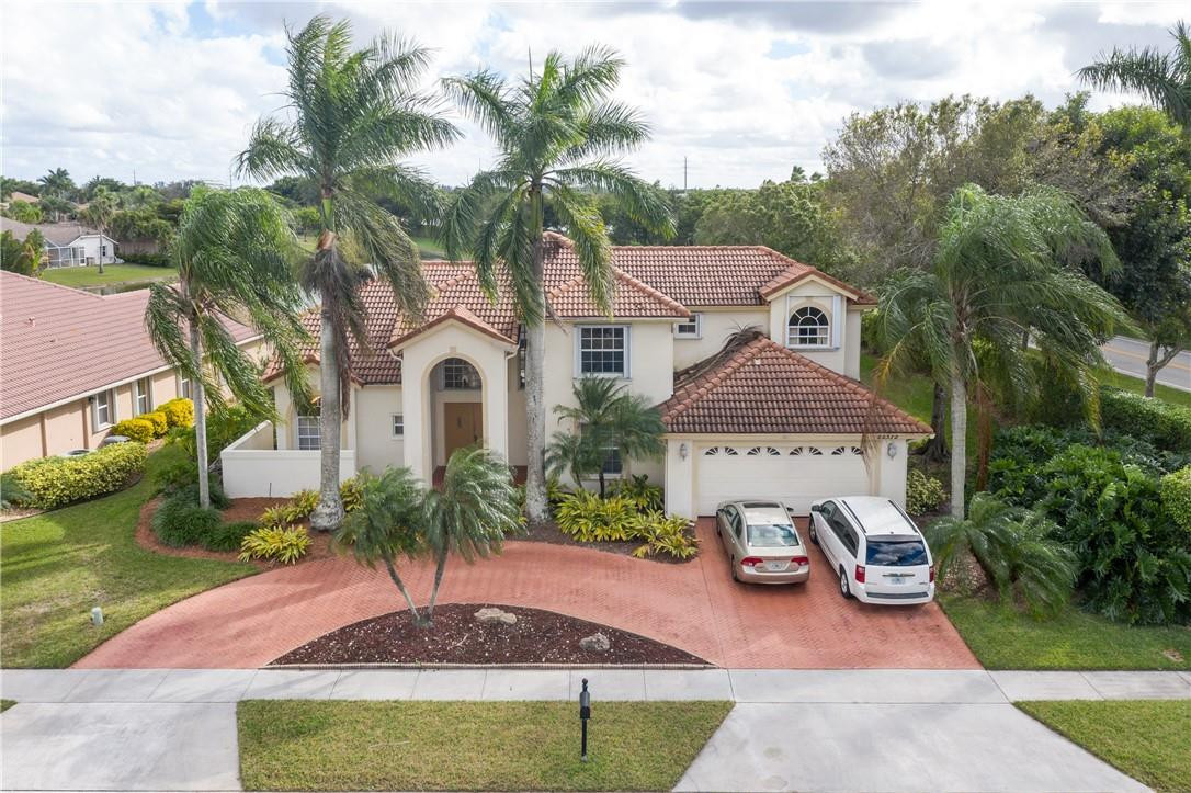 22372 Collington Drive Boca Raton, FL 33428 - Photo 5 of 22 a front view of a house with garden