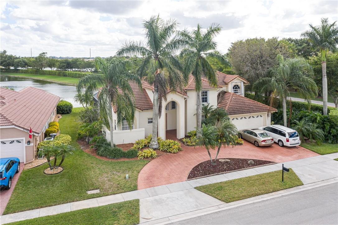 22372 Collington Drive Boca Raton, FL 33428 - Photo 6 of 22 an aerial view of a house with garden space and lake view
