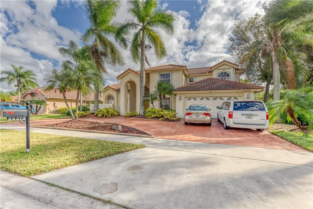 22372 Collington Drive Boca Raton, FL 33428 - Photo 8 of 22 a car parked on the side of the road