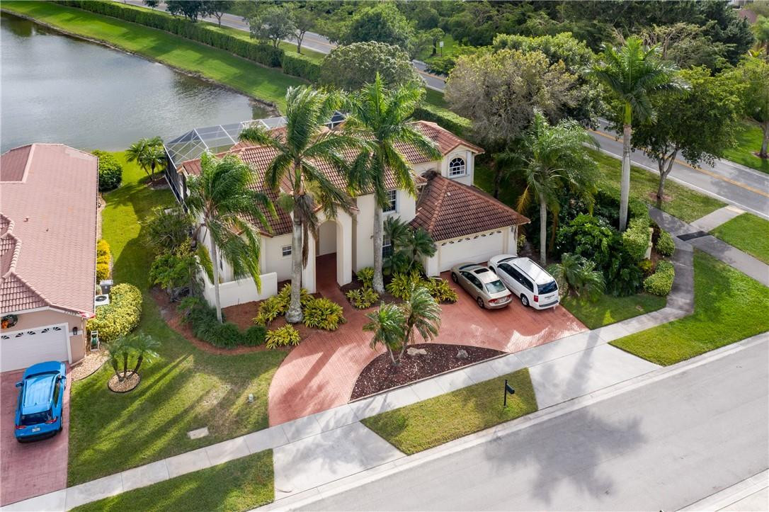 22372 Collington Drive Boca Raton, FL 33428 - Photo 9 of 22 an aerial view of a house with yard swimming pool and outdoor seating
