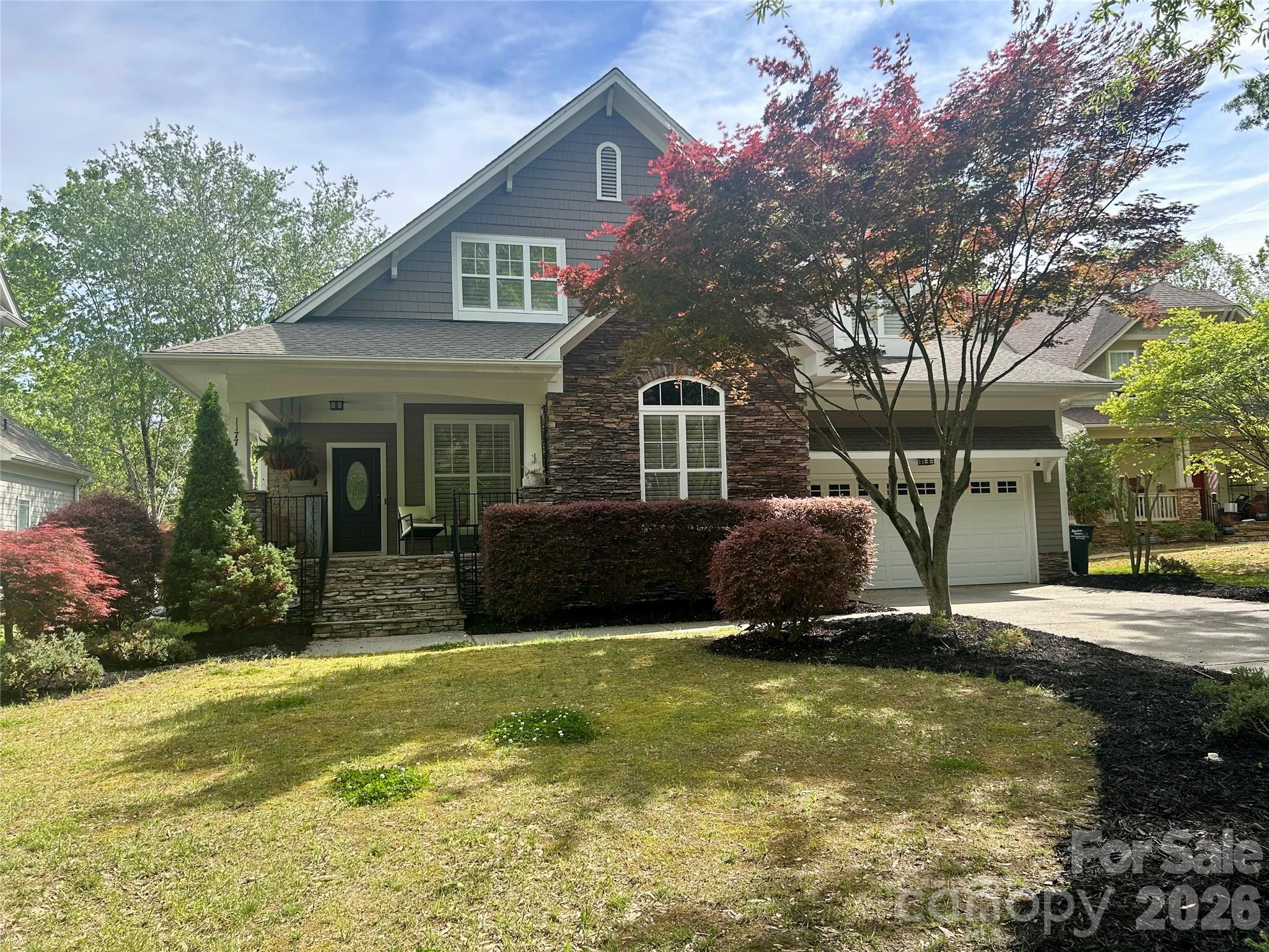a view of a house with backyard porch and sitting area