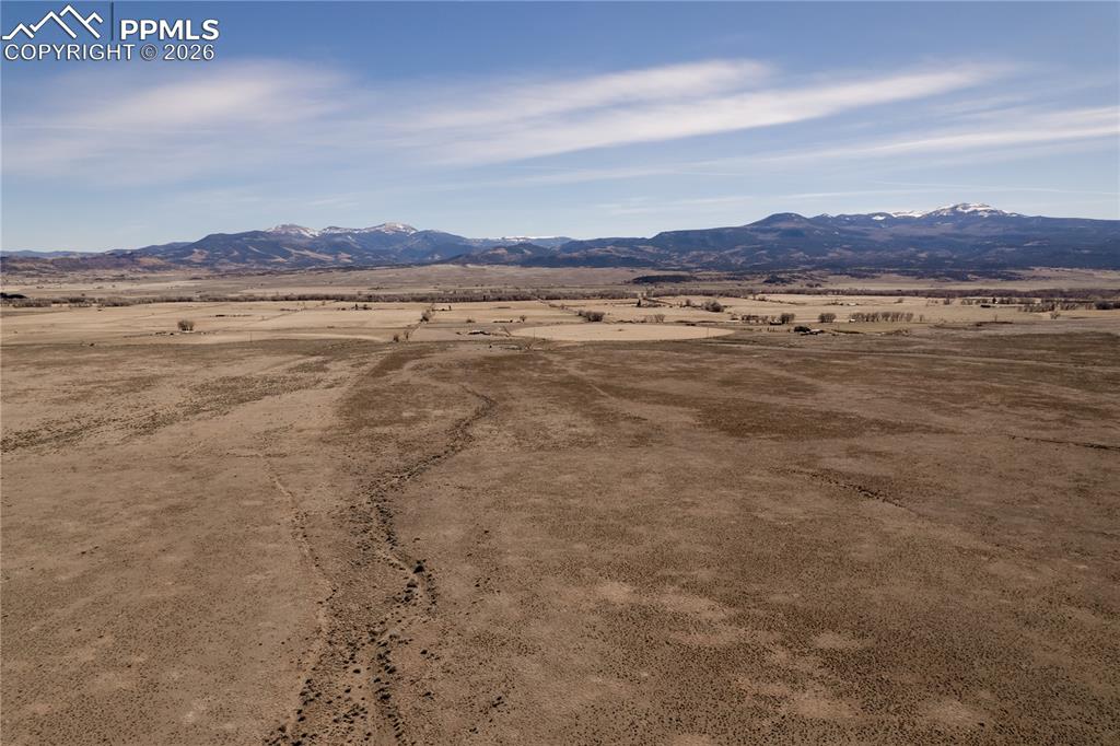 0 County Road 15 Road Del Norte, CO 81132 - Photo 4 of 16 View of mountain backdrop with rural landscape and a desert landscape