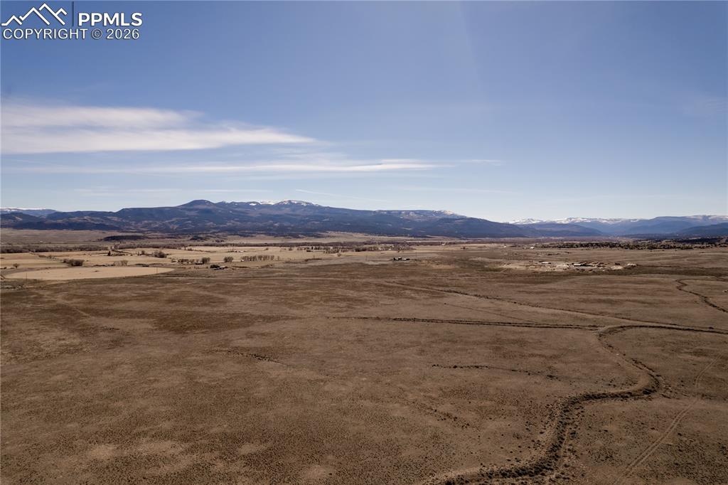 0 County Road 15 Road Del Norte, CO 81132 - Photo 5 of 16 View of mountain backdrop with rural landscape and a desert landscape