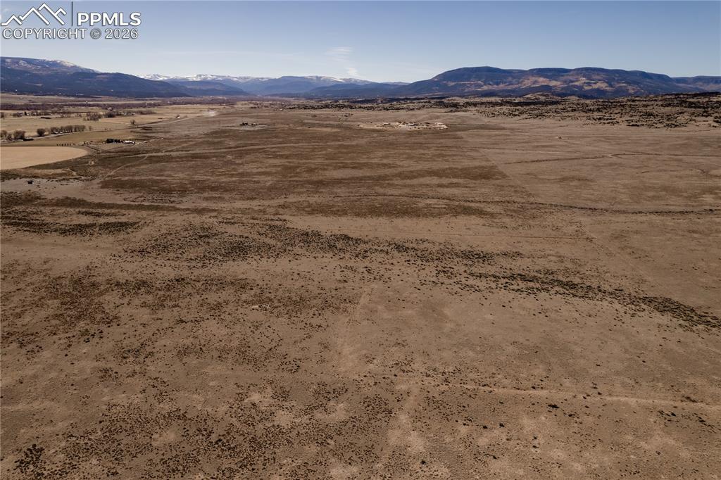 0 County Road 15 Road Del Norte, CO 81132 - Photo 7 of 16 View of mountain backdrop with a desert landscape and rural landscape