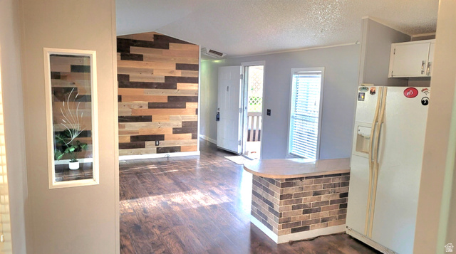 1525 South 400 East, Unit 63 Springville, UT 84663 - Photo 15 of 36 Foyer with dark wood finished floors and wooden walls