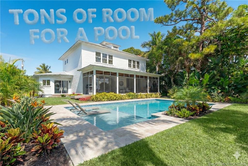 a view of house with yard outdoor seating and entertaining space