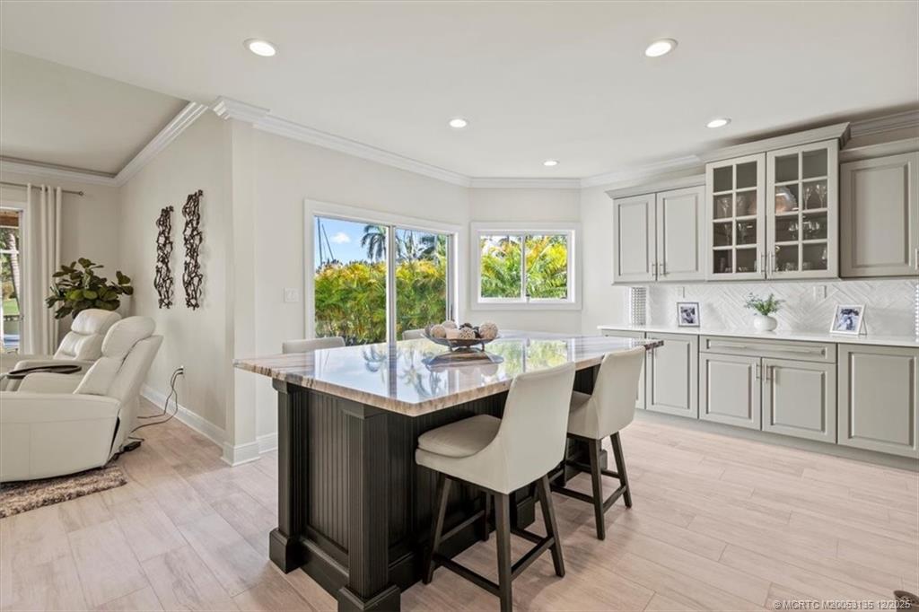 3404 Southeast Inlet Harbor Trail Stuart, FL 34996 - Photo 13 of 32 a view of a dining room with furniture and window