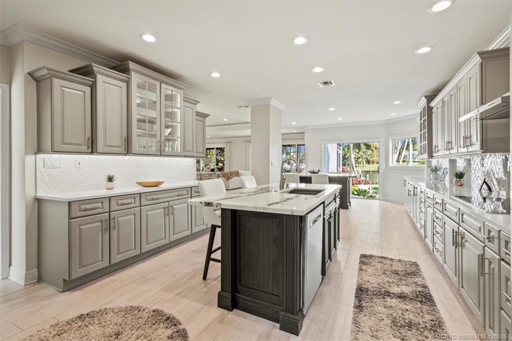 3404 Southeast Inlet Harbor Trail Stuart, FL 34996 - Photo 14 of 32 a kitchen with counter top space sink and center