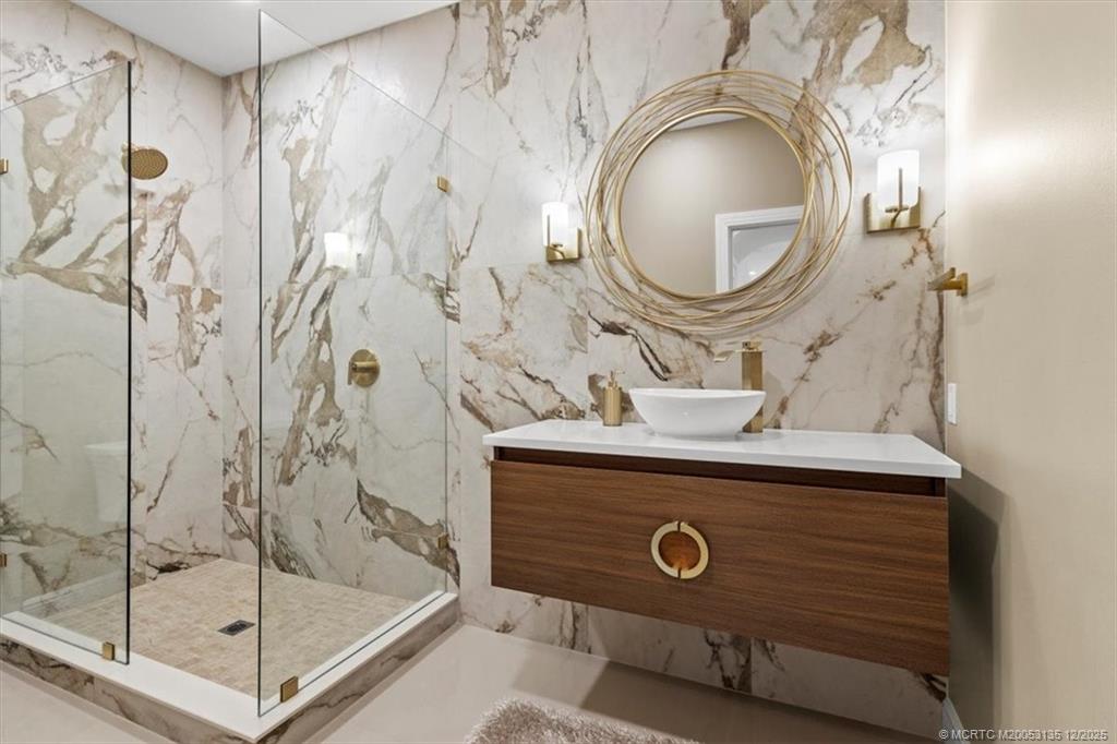 3404 Southeast Inlet Harbor Trail Stuart, FL 34996 - Photo 20 of 32 a bathroom with a sink and a mirror
