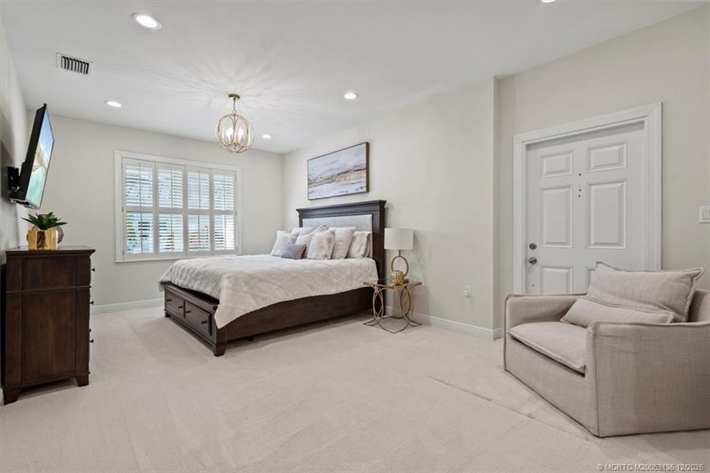 3404 Southeast Inlet Harbor Trail Stuart, FL 34996 - Photo 24 of 32 a bedroom with a bed and window