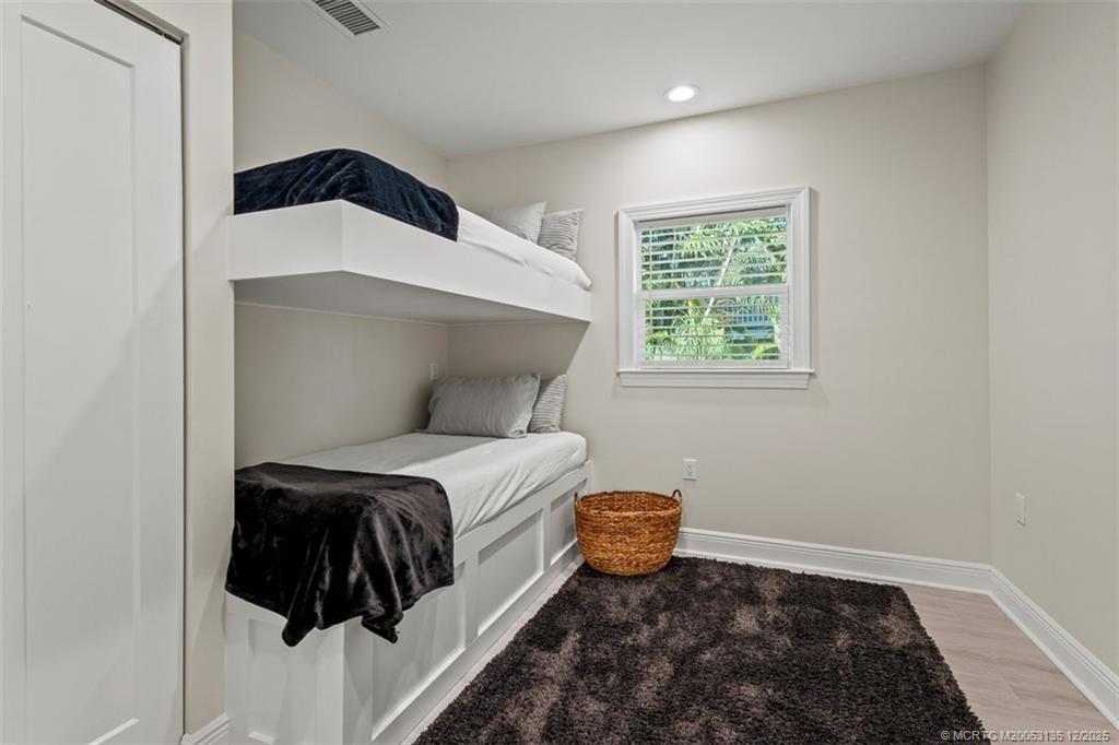 3404 Southeast Inlet Harbor Trail Stuart, FL 34996 - Photo 25 of 32 a bedroom with a bed and a window