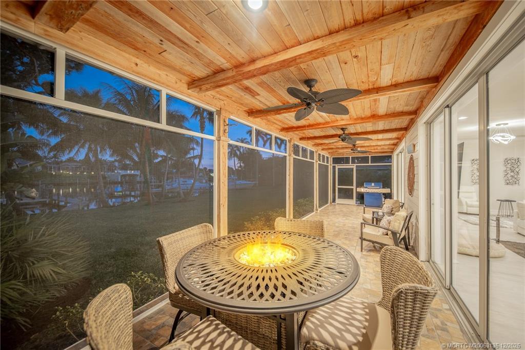 3404 Southeast Inlet Harbor Trail Stuart, FL 34996 - Photo 32 of 32 a view of a balcony with table and chairs
