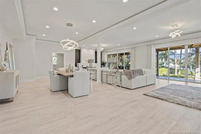 a kitchen with granite countertop a sink a stove and cabinets