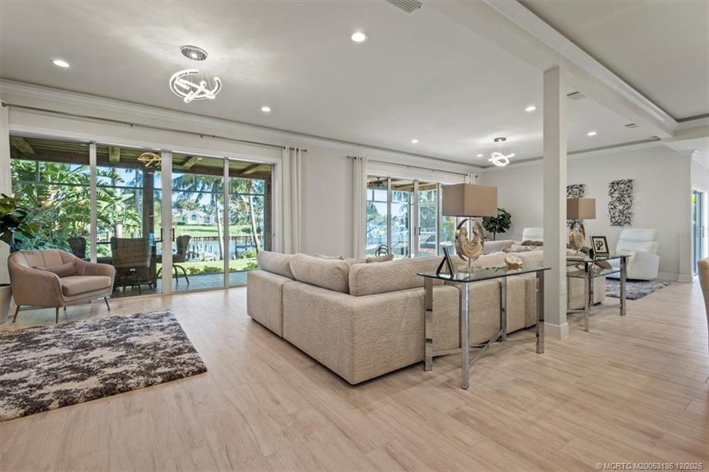 3404 Southeast Inlet Harbor Trail Stuart, FL 34996 - Photo 9 of 32 a living room with furniture and a large window