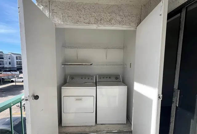 a close view of a utility room with washer and dryer