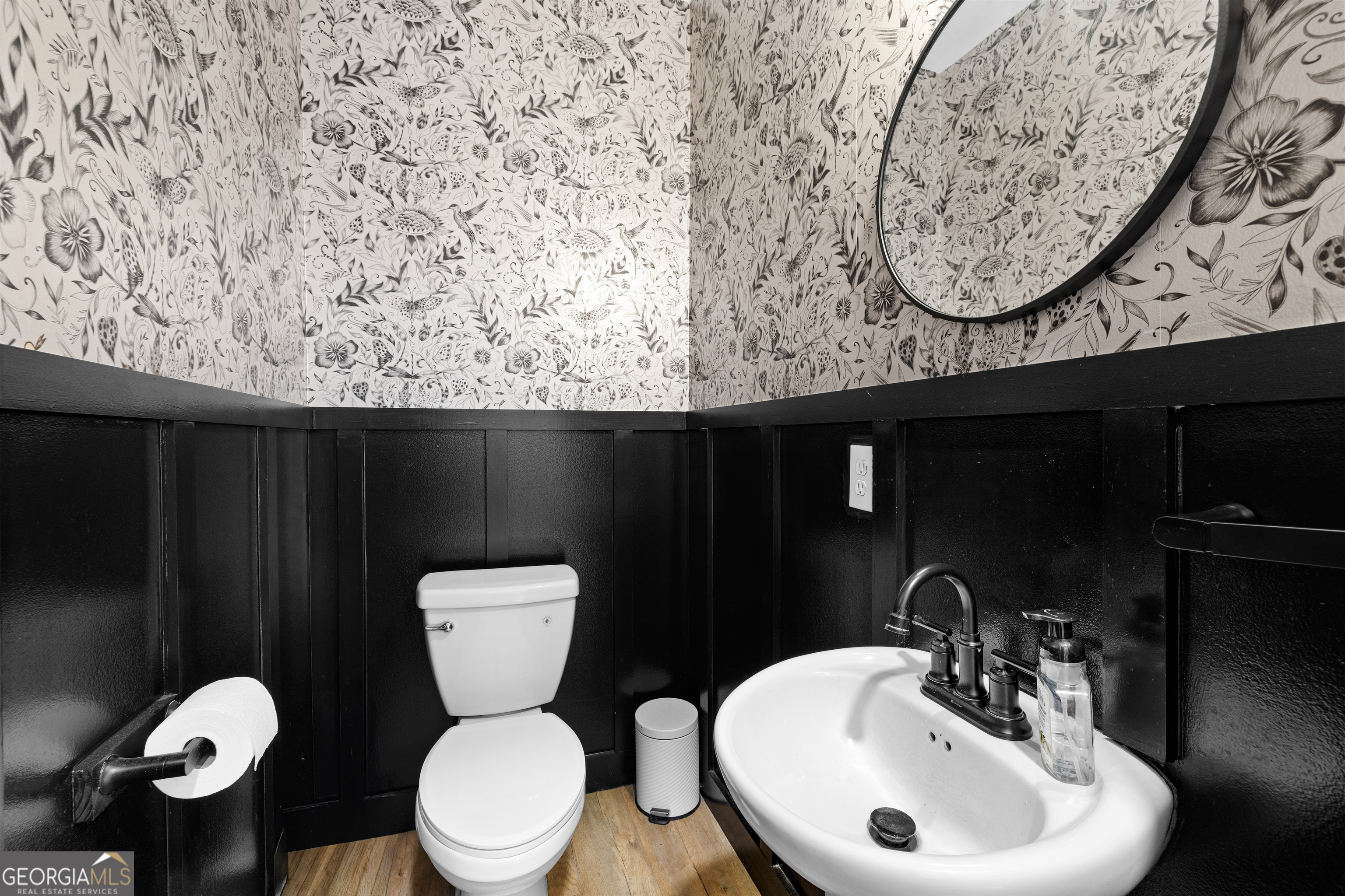 1329 Standing Rock Road Senoia, GA 30276 - Photo 48 of 77 a bathroom with a toilet sink and mirror