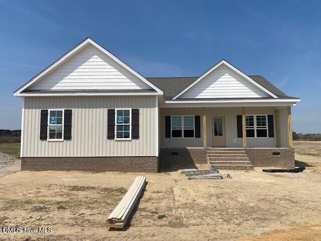 7712 New Sandy Hill Sims, NC 27880 - Photo 1 of 2 a front view of a house with a yard
