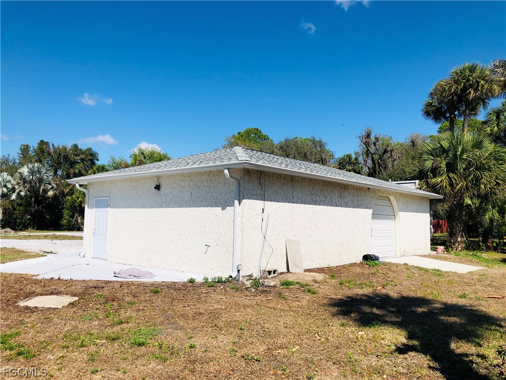17500 Taylor Road Alva, FL 33920 - Photo 6 of 10 a view of a house with a yard