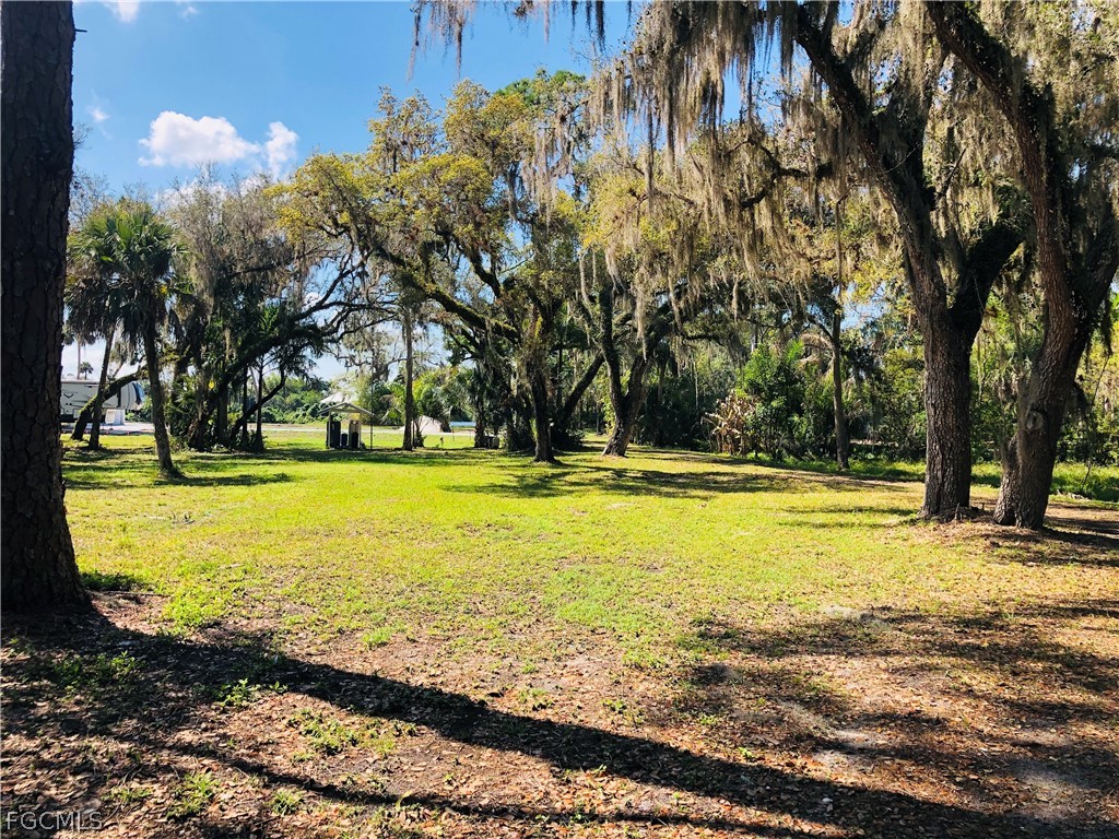 17500 Taylor Road Alva, FL 33920 - Photo 8 of 10 a view of swimming pool with an outdoor space and seating area