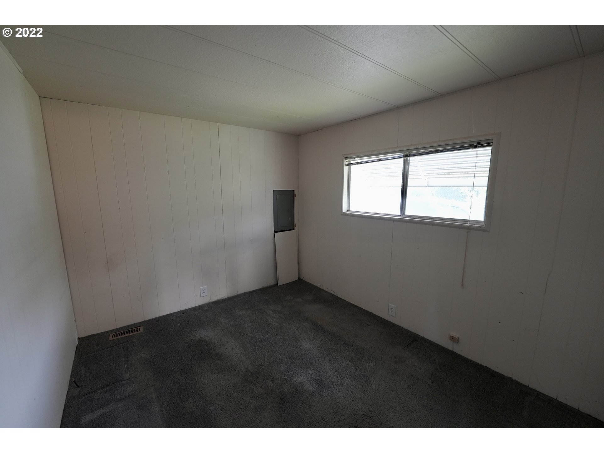 3530 Game Farm Road, Unit 11 Springfield, OR 97477 - Photo 11 of 27 a view of an empty room with a window