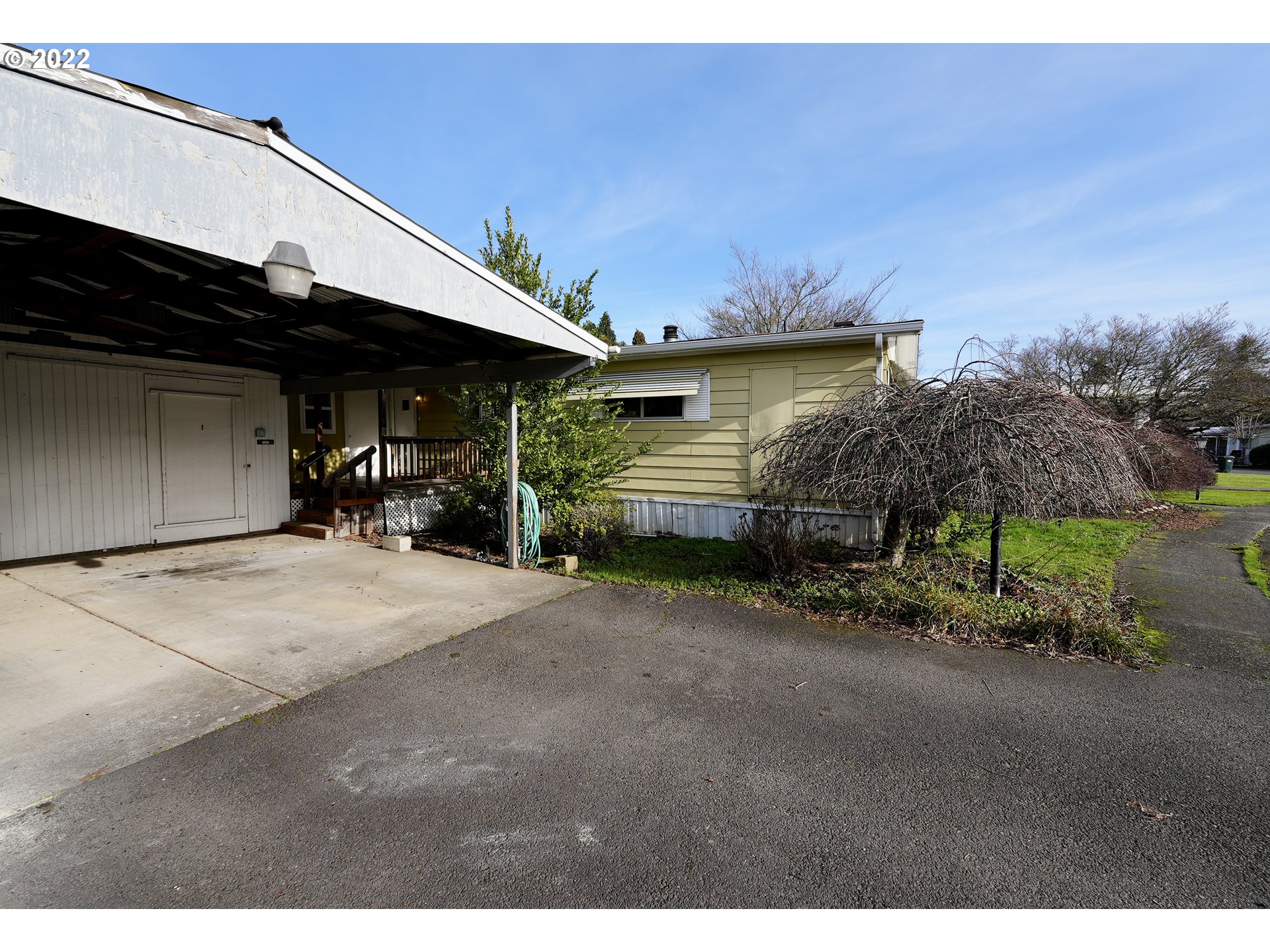 3530 Game Farm Road, Unit 11 Springfield, OR 97477 - Photo 17 of 27 a front view of a house with a yard and garage